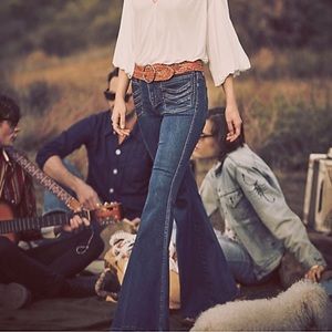 Flared denim jeans with detailed pockets